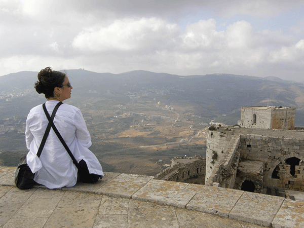 Rihab Sawah enjoys her favorite valley at al-Hosn Citadel during a visit to Syria in 2010. (Provided photo)