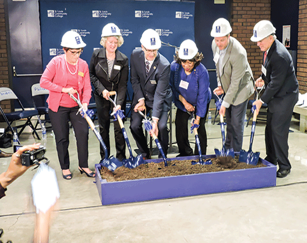 Chancellor Jeff Pittman, third from left, joins STLCC board members, from left Libby Fitzgerald, Pam Ross, Doris Graham, Kevin Martin and Craig Larson at the groundbreaking ceremony for the new Center for Nursing and Health Sciences on March 23. (Photo by Timothy Bold)