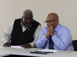 Edward Alexander, president of the Forest Park Veterans Club, speaks to Interim President Roderick Nunn at the special SGA meeting. (Photo by Tina Alberico)