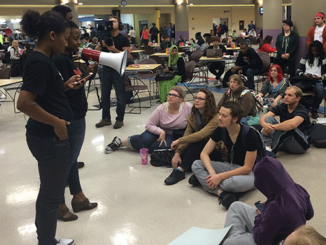 Ferguson protester Britney Ferrell uses a megaphone to speak to Meramec students at the teach-in on Oct. 13. (Photo provided by Suzan Dague)