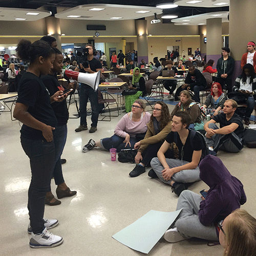 Ferguson protester Britney Ferrell uses a megaphone to speak to Meramec students at the teach-in on Oct. 13.  (Photo provided by Suzan Dague)