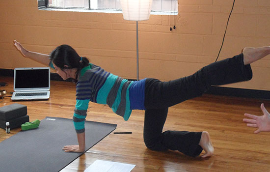 Forest Park student Christy Lin demonstrates a yoga move. (Photo by Don Dixon)