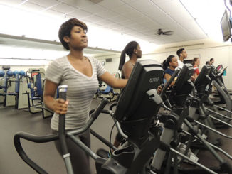 Nursing student Donshay Smith and her classmates work out on treadmills in a Fitness I class in the fitness center. (Photo by Yuanyuan Ji )
