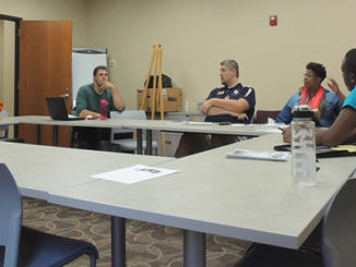 Left to right, DeMarco Burr, Matt Holley, Kirk Martin, Nikita Anthony and Brandon Haywood hold a Voices meeting in the Campus Life office. (Photo by Evan Sandel)