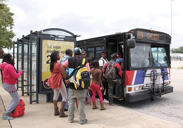Forest Park students board the No. 59 Dogtown bus on Oakland Avenue. (Photo by Tina Alberico)