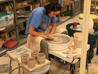 Ceramic Technician Marija Lajisic uses a pottery wheel to make cups for this year’s St. Louis Art Fair in Clayton. (Photo by Garrieth Crockett)