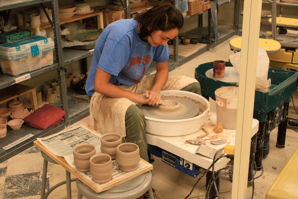 Ceramic Technician Marija Lajisic uses a pottery wheel to make cups for this year’s St. Louis Art Fair in Clayton. (Photo by Garrieth Crockett)