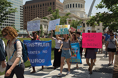 Protesters in a Families Belong Together march through Keiner Plaza in downtown St. Louis on June 14. They were demonstrating against the separation of families at the U.S.-Mexico border. (Photo by Daniel Shular)