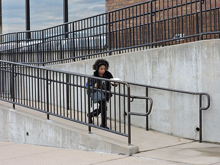 General transfer student Tamria Harris, 18, walks down a wheelchair ramp outside the Student Center. (Photo by Timothy Bold)