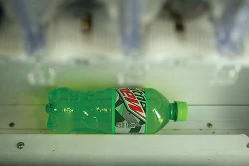 An undelivered Mountain Dew lies marooned at the bottom of a vending machine on the fourth floor of F Tower. (Photo by Daniel Shular)