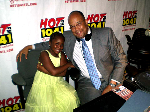 Vice President of Student Affairs Thomas Walker poses with his daughter, Paige, 10, after doing an interview on urban education with Hot 104.1 FM. (Provided Photo)