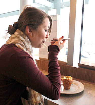 Kaela Fahrinthold enjoys her muffin at Comet Coffee. (Photo by Jasmine Bell)