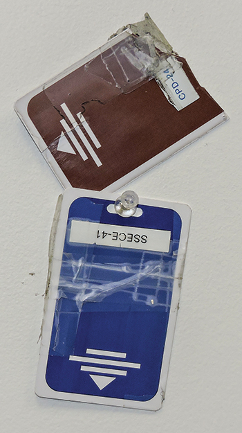 Worn-out keycards get a second life as bulletin board “art” in Tim Cary’s office. (Photo by Tmothy Bold)