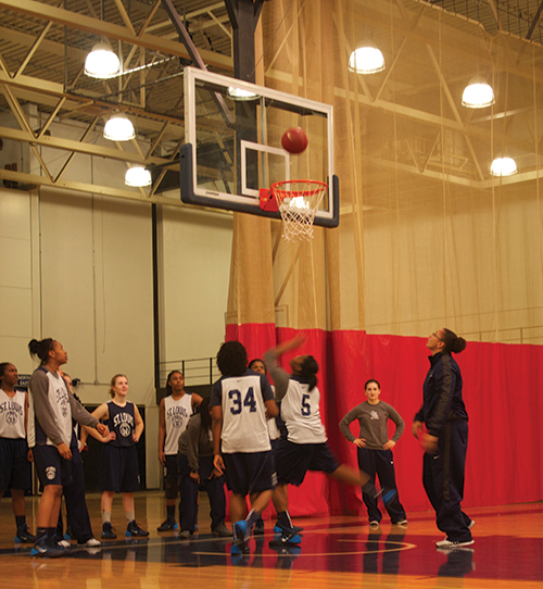 Freshman center Nika Ewing shoots a basket during practice on the Forest Park campus. ( Photo by Evan Sandel)