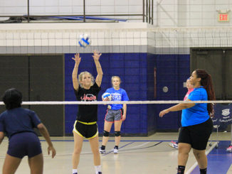 Paige Masterson sets up the ball while co-captain Eryca Sutherlin waits at a practice on the Florissant Valley campus. (Photo by Evan Sandel)