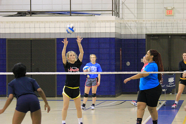 Paige Masterson sets up the ball while co-captain Eryca Sutherlin waits at a practice on the Florissant Valley campus.  (Photo by Evan Sandel)