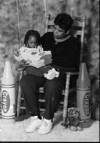 Linda Foster reads to a day-care student; she lost her job when the center closed, prompting her to enrol at Forest Park. (Provided photo)