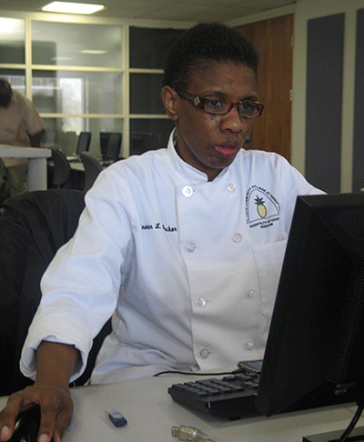 Wauneen Rucker works in a D Tower computer lab on campus; she cut her hair after the pageant. (Photo by Garrieth Crockett)