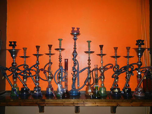 Hookahs are lined up, waiting for smokers. (Photo by Kevin Gomez)