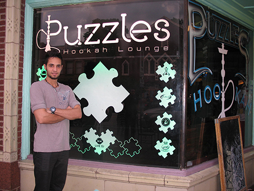 Co-owner Amir Sadri stands outside his new business. (Photo by Kevin Gomez)