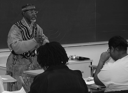 Professor Ronald Henry gives a lesson on Malcolm X in his African American History II class. (Photo by Garrieth Crockett)