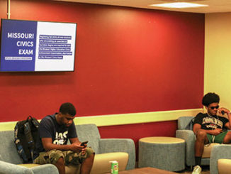 One of several TV sets on campus, this one in the Student Center lobby, highlights news and events, including the new Missouri civics exam requirement. (Photo by Mark Ngunjiri)