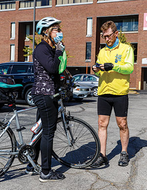 Forst Park faculty members Lori Orlando and Keith Hulsey prepare for the bike ride. (Photo by Fred Ortlip)