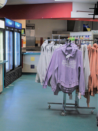 STLCC sweatshirts hang near a beverage case in the new bookstore.  (Photo by Leilani England)