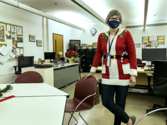 President Julie Fickas visited offices and classrooms around the Forest Park campus on Wednesday, passing out candy canes and spreading holiday cheer to employees tying up loose ends on the last day before winter break.