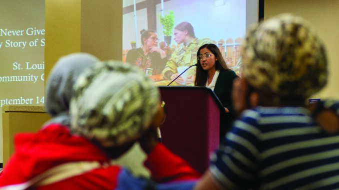 ZamZama Safi speaks about her life in Afghanistan in the Forest Park cafeteria. She’s asking for help to bring her family to the United States. (Photo by Michelle Compton)